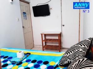 a living room with a couch and a table at Hospedaje Anny in Larán +27 photos