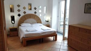 Cama o camas de una habitación en Appartamenti Magnolia