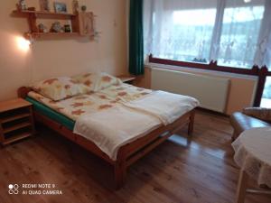 Postel nebo postele na pokoji v ubytování Jarzębinka