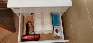 a pile of paper towels under a bathroom sink at Apartment TiSa, Bled in Bled