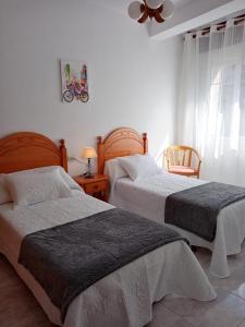 Katil atau katil-katil dalam bilik di Apartamento A Canteira