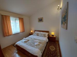 Posteľ alebo postele v izbe v ubytovaní Apartments Palić
