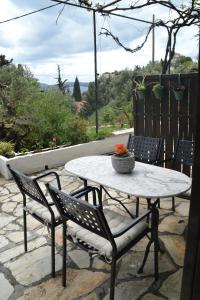 a table and chairs sitting on a patio at A Place to Relax 1 in Nisakion