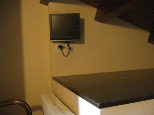 En tv och/eller ett underhållningssystem på La Campana D'Oro
