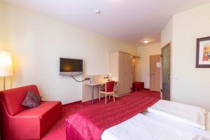TV a/nebo společenská místnost v ubytování Hotel An der Eiche