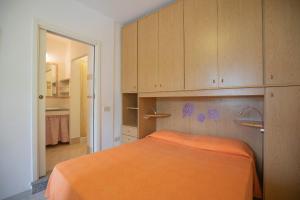 Ένα ή περισσότερα κρεβάτια σε δωμάτιο στο Casa Vacanze Lentisco by HelloElba