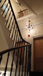 
a staircase leading up to a stair case at Braidmead House in Irvine
