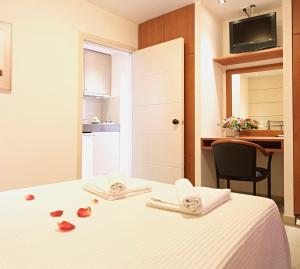 Postel nebo postele na pokoji v ubytování Hotel Galaxias
