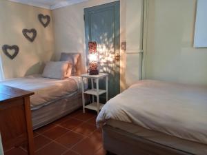 Postel nebo postele na pokoji v ubytování Avondrust Guest House
