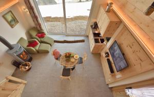 an overhead view of a living room with a table at Chalets am Rößle in Todtmoos