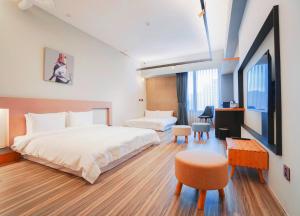 Postel nebo postele na pokoji v ubytování Thinker Hotel