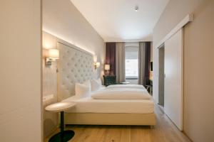 Posteľ alebo postele v izbe v ubytovaní Hotel Sailer