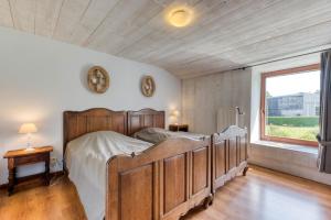 Voodi või voodid majutusasutuse Château Ferme de Laval toas