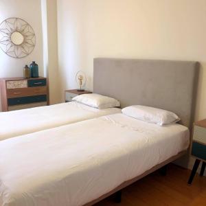 Uma cama ou camas num quarto em Azores Avenida E Apartment T3