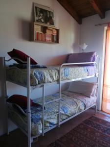 A bed or beds in a room at B&B Antica Corte Lombarda