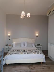 מיטה או מיטות בחדר ב-Hotel Antica Cascina Del Golfo