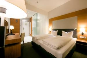 Posteľ alebo postele v izbe v ubytovaní Hotel Sailer
