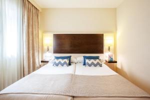 Postel nebo postele na pokoji v ubytování Grupotel Dunamar