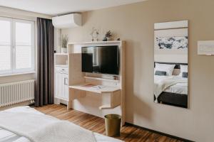 Postel nebo postele na pokoji v ubytování Maiers Johanniterbad Ringhotel Rottweil