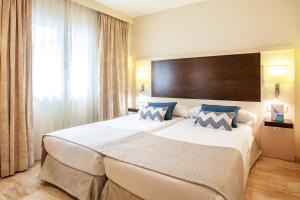 Postel nebo postele na pokoji v ubytování Grupotel Dunamar