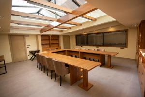 a dining room with a large wooden table and chairs at Beşiktaş Serenity Hotel in Istanbul