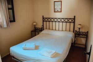 Postel nebo postele na pokoji v ubytování Camping La Aldea