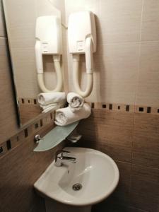 a bathroom with a sink and a mirror at Moreno in Sozopol +33 photos