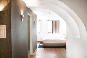 Postel nebo postele na pokoji v ubytování KU Hotel by WMM Hotels