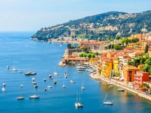 a view of a harbor with boats in the water at Escape to the French Riviera in Villefranche-sur-Mer