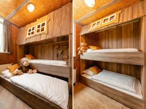 two bunk beds in a room with wood walls at 8- person childbungalow - Theme Farm Adapted in Zuna