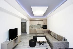 a living room with a couch and a table at Excellent apartment in the center of the Yerevan 15 in Yerevan