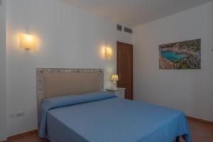 Postel nebo postele na pokoji v ubytování Casa Vacanze Palau