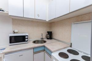 Kuchyň nebo kuchyňský kout v ubytování Apartments Manda