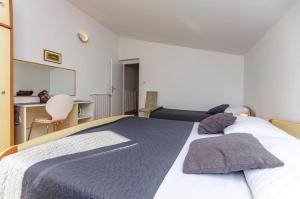 Postel nebo postele na pokoji v ubytování Apartments Manda