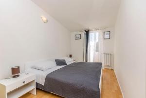 Postel nebo postele na pokoji v ubytování Apartments Manda
