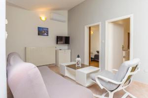 TV a/nebo společenská místnost v ubytování Apartments Manda