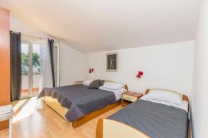 Postel nebo postele na pokoji v ubytování Apartments Manda
