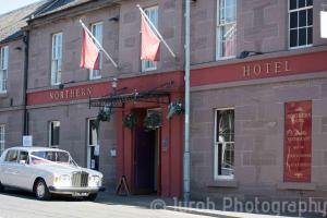 a white car parked in front of a hotel at Northern Hotel in Brechin