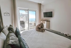 TV a/nebo společenská místnost v ubytování Apartment Rocha Vista Mar Dubai