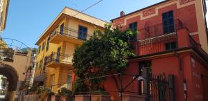 a row of colorful buildings on a street at Hotel Margherita in Monterosso al Mare