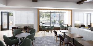 a living room with tables and chairs and a couch at Staybridge Suites - Houston NW Cypress Crossings , an IHG Hotel in Houston