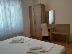 Postel nebo postele na pokoji v ubytování Apartments EDO
