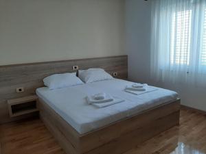 Postel nebo postele na pokoji v ubytování Apartments EDO