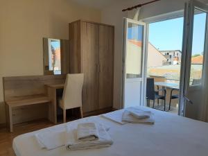 Postel nebo postele na pokoji v ubytování Apartments EDO