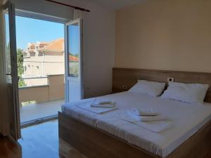 Postel nebo postele na pokoji v ubytování Apartments EDO