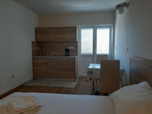 Postel nebo postele na pokoji v ubytování Apartments EDO