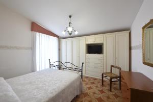 Ένα ή περισσότερα κρεβάτια σε δωμάτιο στο Villa Dafne mare Fondi Sperlonga
