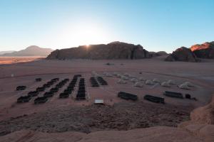 a parking lot in the middle of a desert at Sun City Camp in Wadi Rum