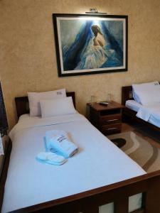 Krevet ili kreveti u jedinici u okviru objekta JOKSIM Rooms&Restaurant