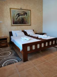 Krevet ili kreveti u jedinici u okviru objekta JOKSIM Rooms&Restaurant